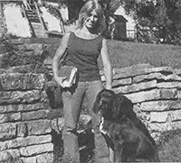 Country vet LuAnn Arney with Bear, her black lab.